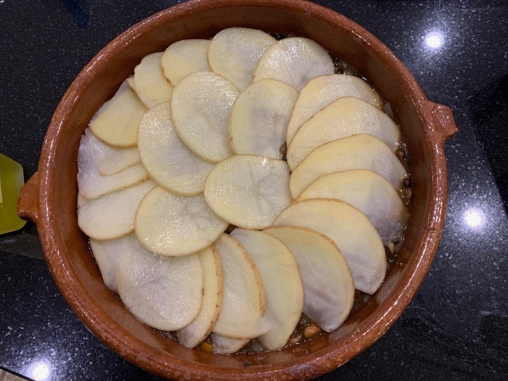 layering the potato slices